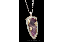 Amethyst spear wrapped in pierced brass flourish (front)